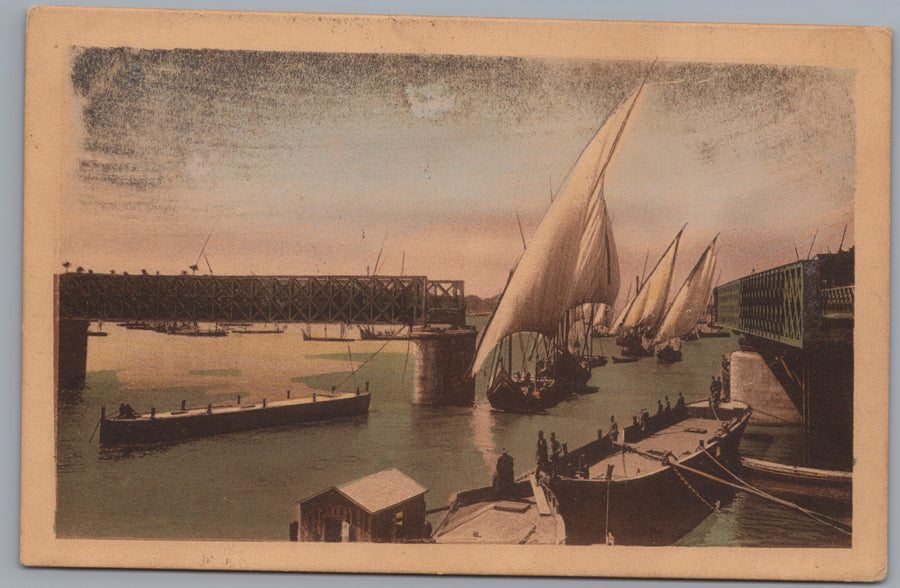 Egypt — Feluccas beside a River Bridge