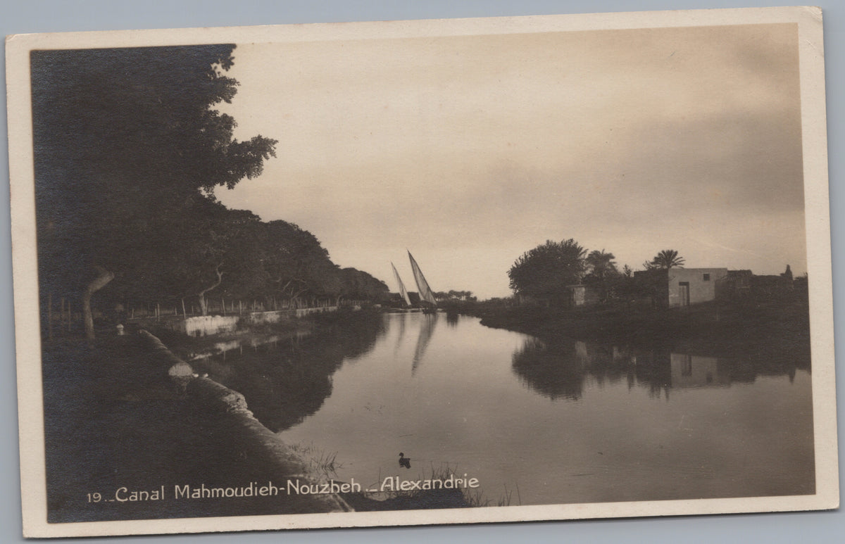 PC01329 | P33 | Alexandria — Reflections on the Mahmoudieh Canal — front