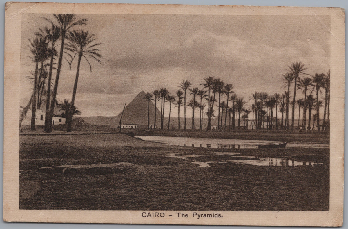 PC02139 front — Pyramids beyond a Palm Grove and Water