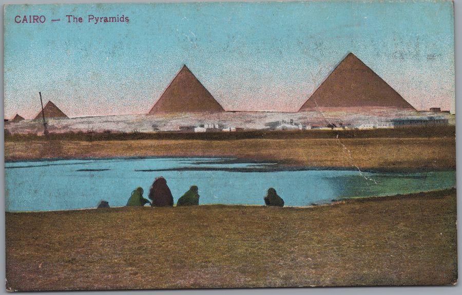 Giza — Pyramids beyond Water and Seated Figures