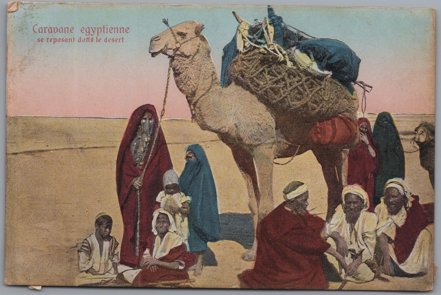 Egypt — Travellers beside a Loaded Camel