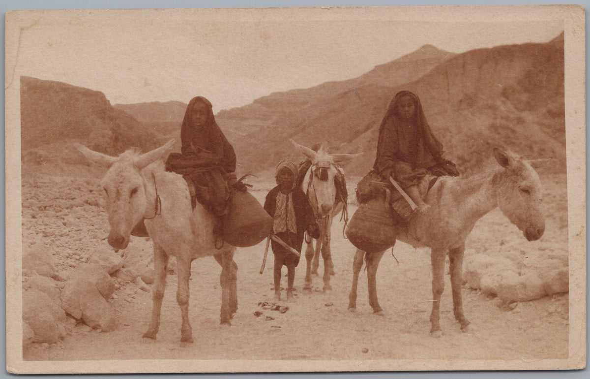 PC01144 | P15 | Egypt — Donkey Riders in a Rocky Valley — front
