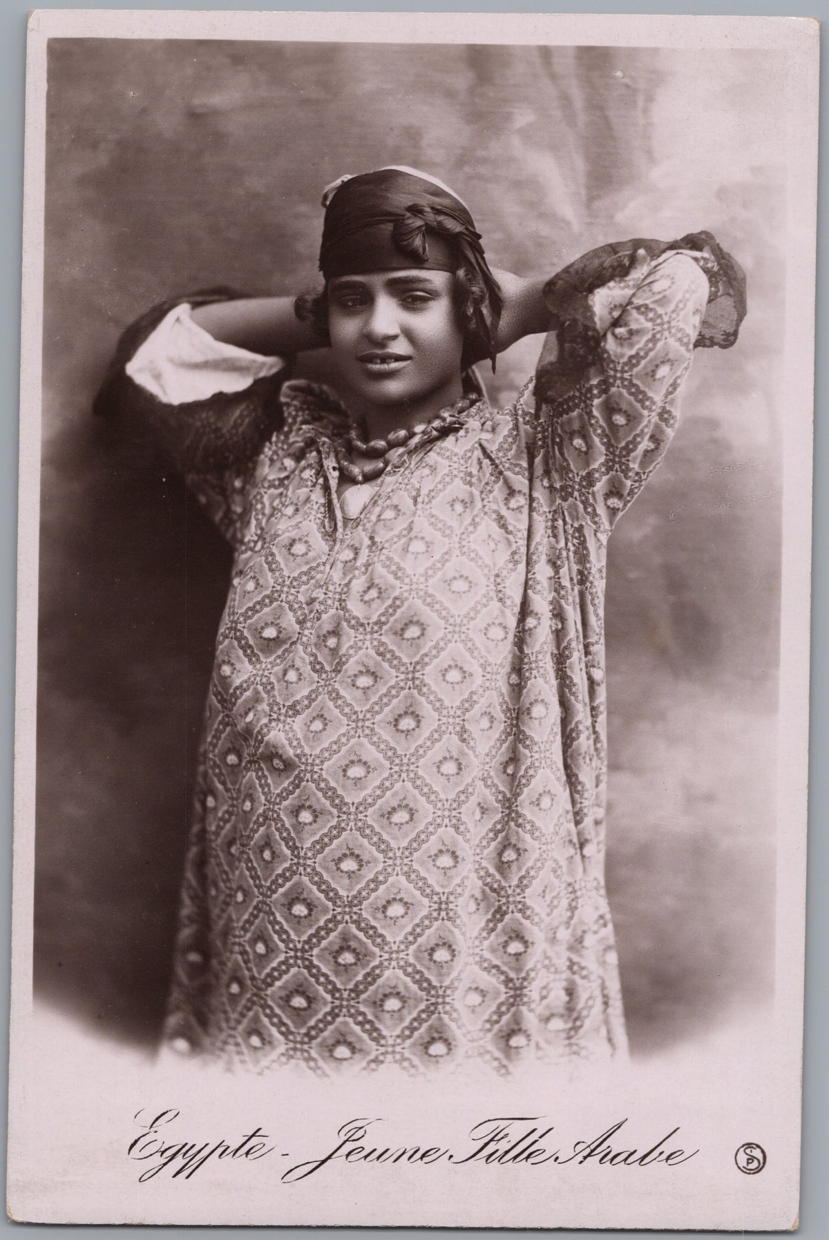 PC01357 | P36 | Egypt — Studio Portrait in a Patterned Garment — front