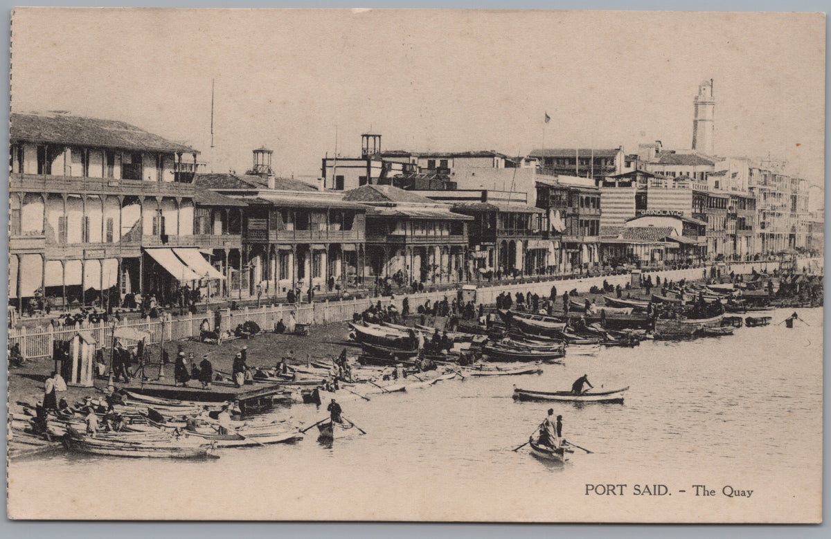 PC02025 front — Busy Quay, Rowboats and Lighthouse