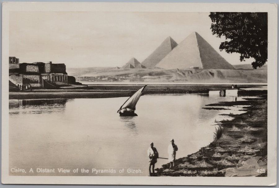 Giza — Pyramids across Water with a Sailing Boat