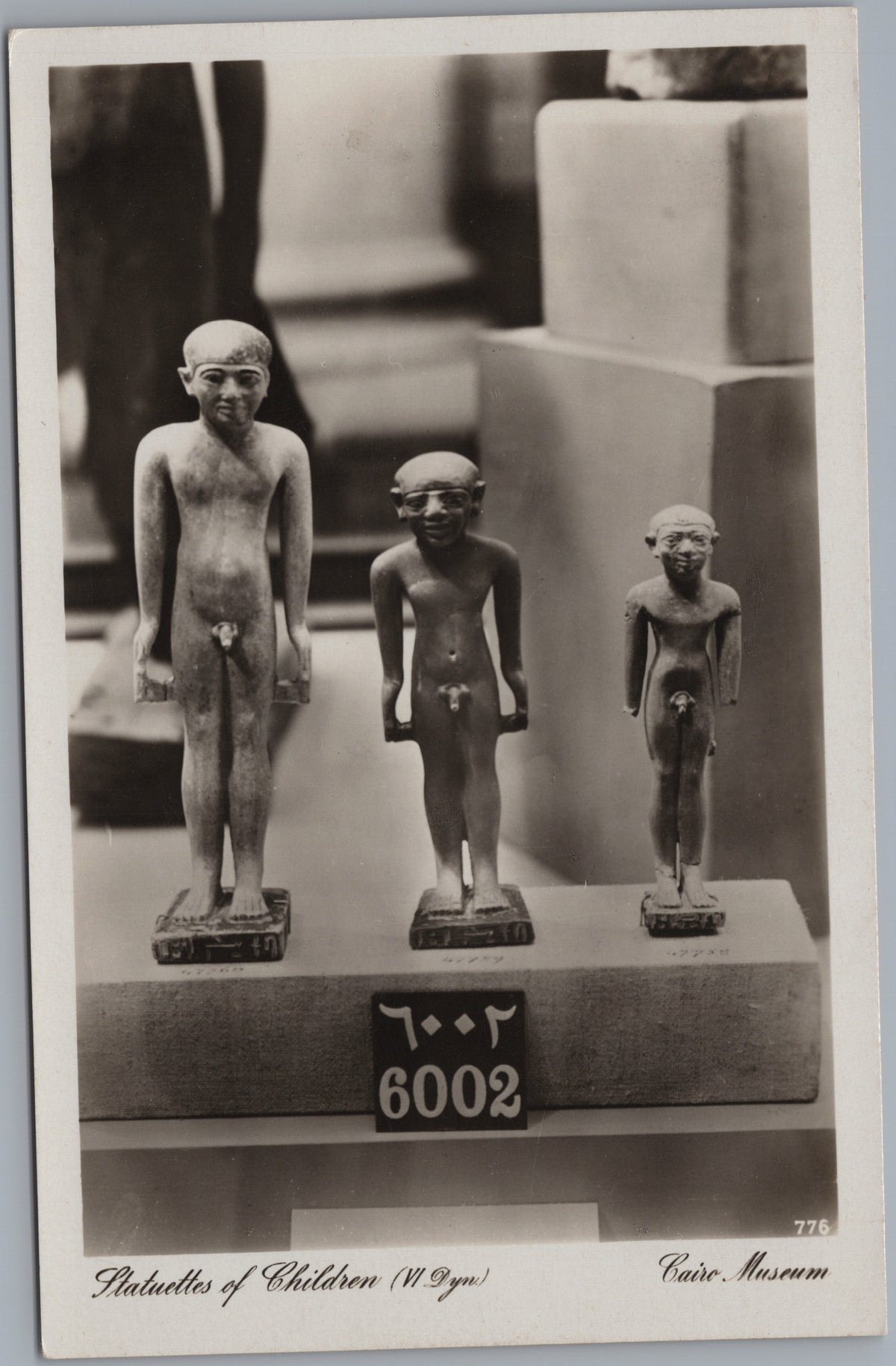 PC02216 front — Museum Display of Three Child Statuettes