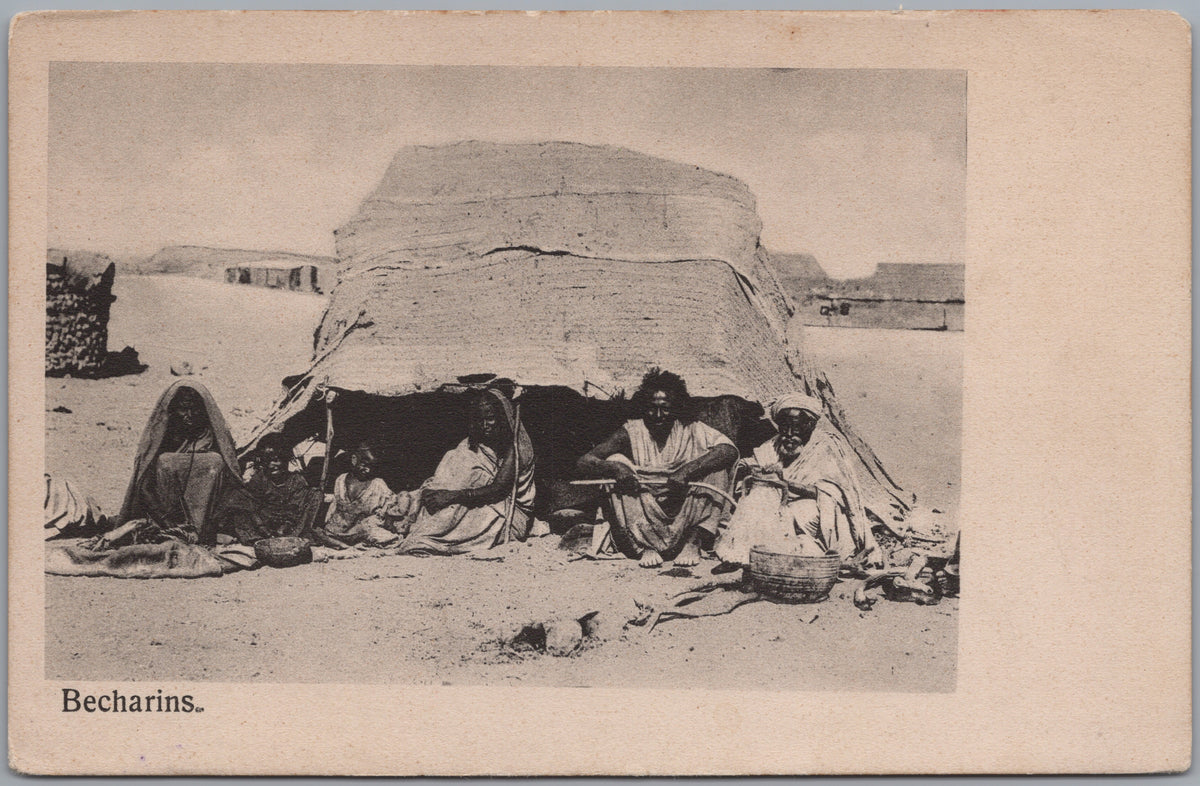 PC02342 front — Group Seated beside a Woven Shelter