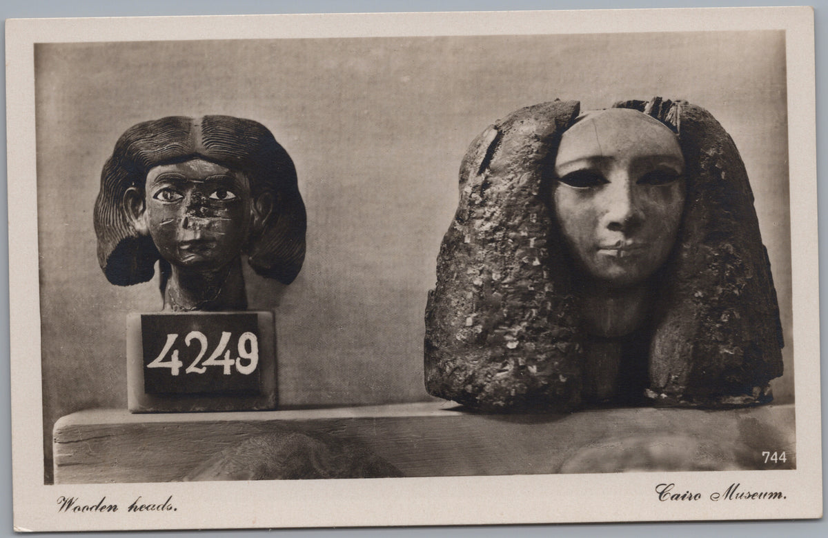 PC02383 front — Two Wooden Heads in the Museum